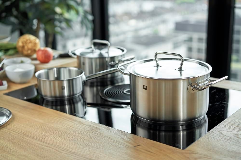 zwilling twin classic 5pc cookware set. 3 ply base. scratch resistant 18/10 stainless steel body. oven safe. dishwasher safe. set: 3 stock pot, 2 frying pans, roaster.