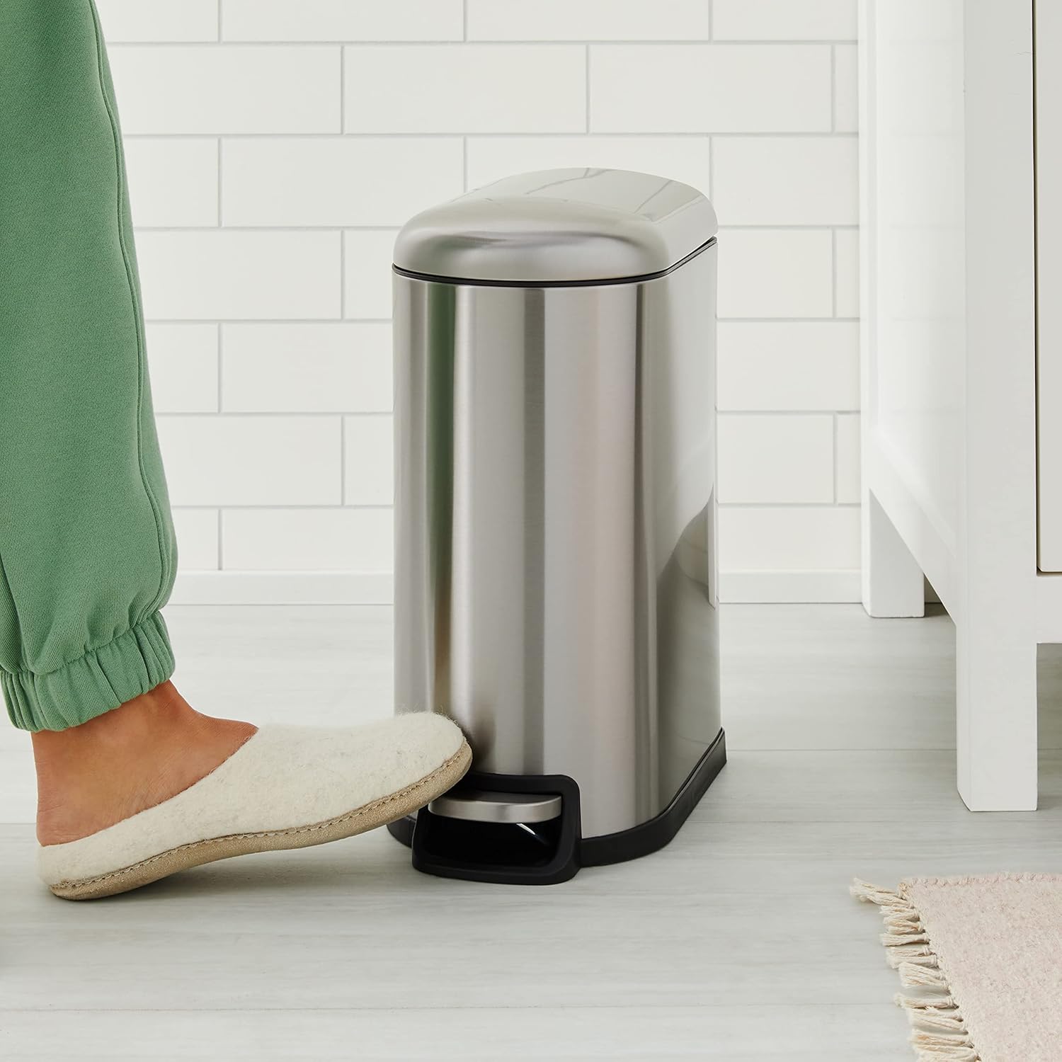 amazonbasics smudge resistant small rectangular trash can with soft close foot pedal for narrow spaces, 10 liter/2.6 gallon, brushed stainless steel