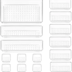 Set of 15 clear plastic drawer organizer trays in assorted sizes for home and office use.