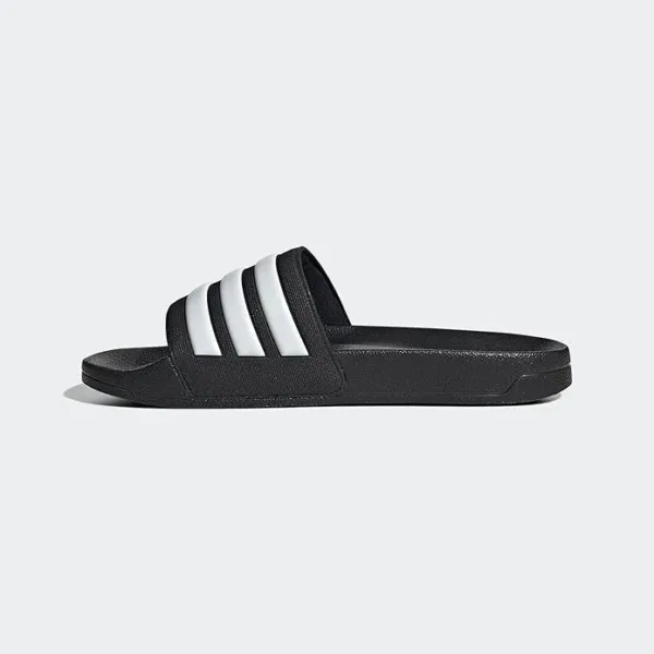 Adidas Adilette shower slides for men – comfortable, water-friendly slip-on sandals for beach, gym, or casual wear with iconic 3-stripe design.