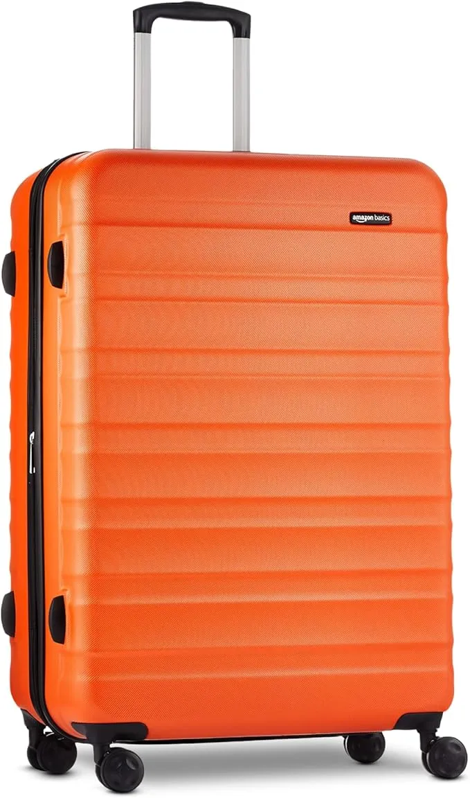 Orange 30-inch hardshell luggage spinner suitcase with durable ABS shell and smooth rolling wheels for convenient travel.