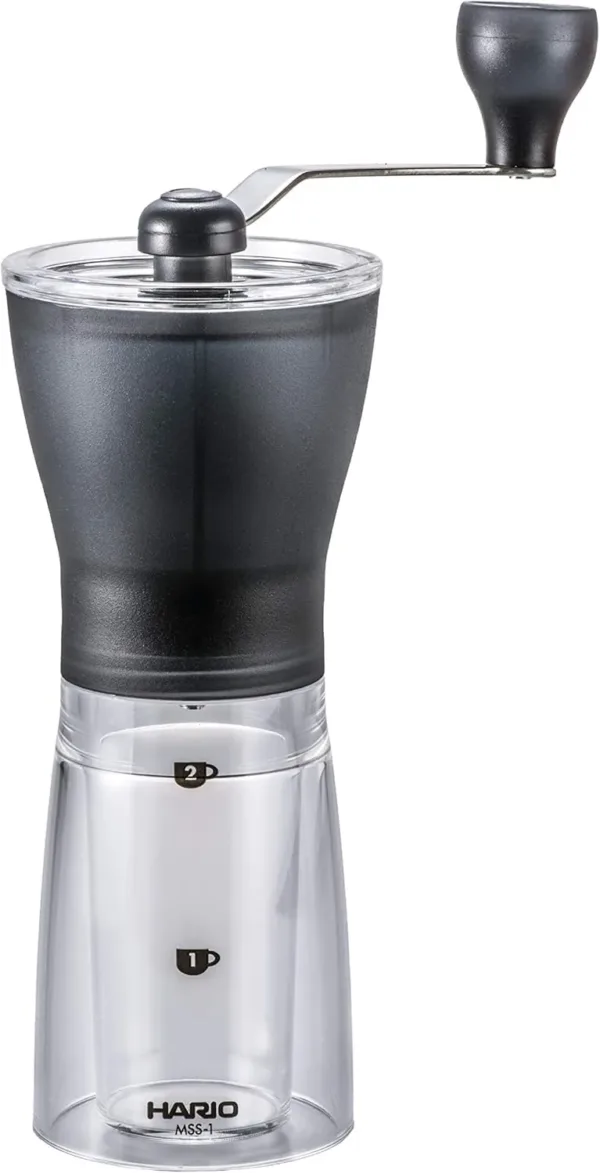Compact manual coffee grinder in black with ceramic burrs and hand crank.