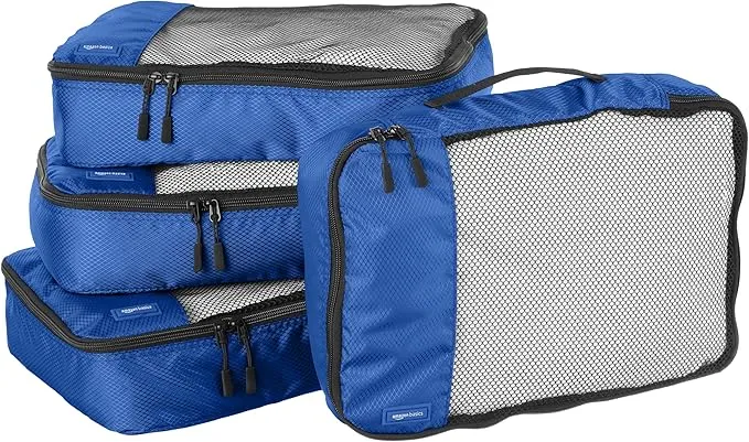 Blue 4-piece packing cubes set for travel, medium size. Zipper organizers for efficient suitcase packing and space-saving during trips.