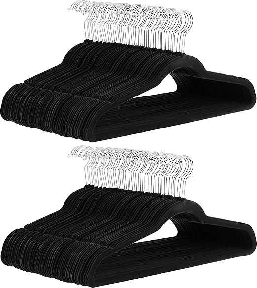 Amazon Basics 100-pack slim velvet hangers with silver metal hooks and a black finish. Non-slip design ensures clothes stay in place for an organized closet.