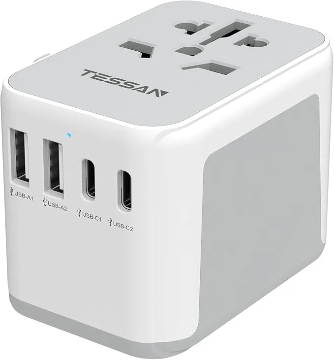 Black universal travel adapter with 2 USB-C and 2 USB-A ports. Compatible with UK, EU, USA, and AU plugs for convenient global charging.