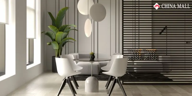 Modern round table and matching chairs set up in a stylish dining room.