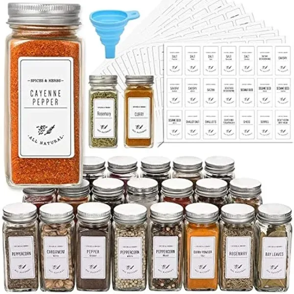 Set of 24 clear 4oz glass spice jars with shaker lids, airtight metal caps, white labels, and a silicone funnel.