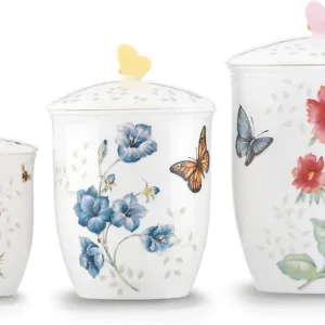 Porcelain salt and pepper shaker set with floral and butterfly design.