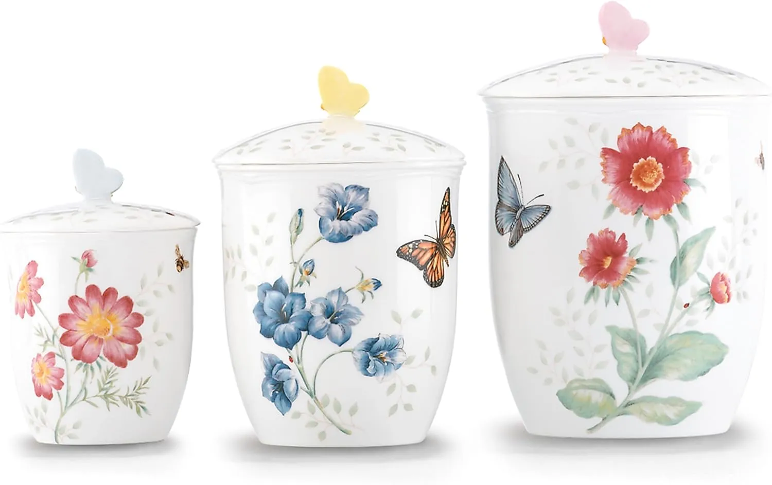 Porcelain salt and pepper shaker set with floral and butterfly design.