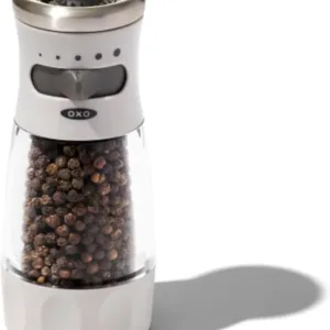Manual pepper grinder with ceramic burr and adjustable grind settings, featuring a mess-free contour design.