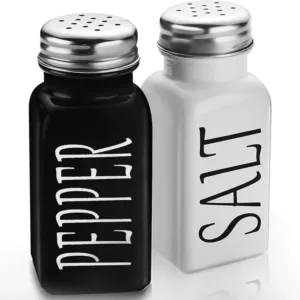 Black and white vintage-style glass salt and pepper shaker set with stainless steel lids.