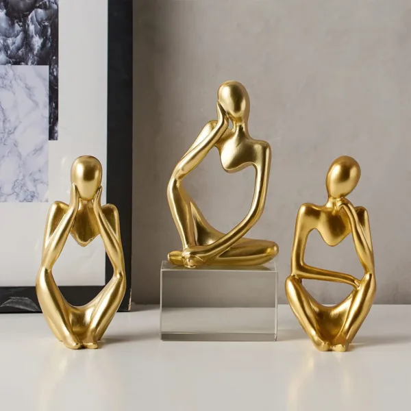 gold thinker statue set 2