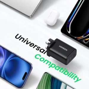 UGREEN Nexode 65W USB C charger with 3 ports, using GaN technology, quickly charging a laptop and phone simultaneously.