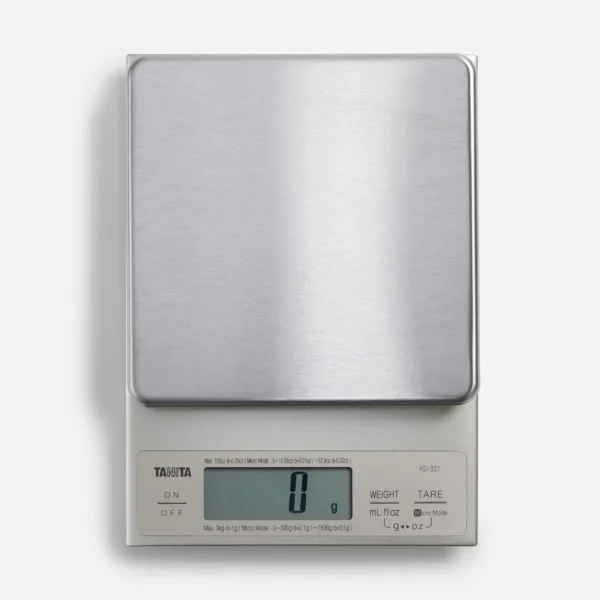 The Tanita KD-321 digital kitchen scale with a removable, easy-to-clean stainless steel weighing platform measures from 0.1 grams to 3000 grams, suitable for molecular cuisine and spices.