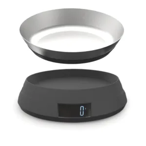This grey Joseph Joseph digital kitchen scale features a reversible lid that transforms into a bowl for easy measuring of loose ingredients and liquids.