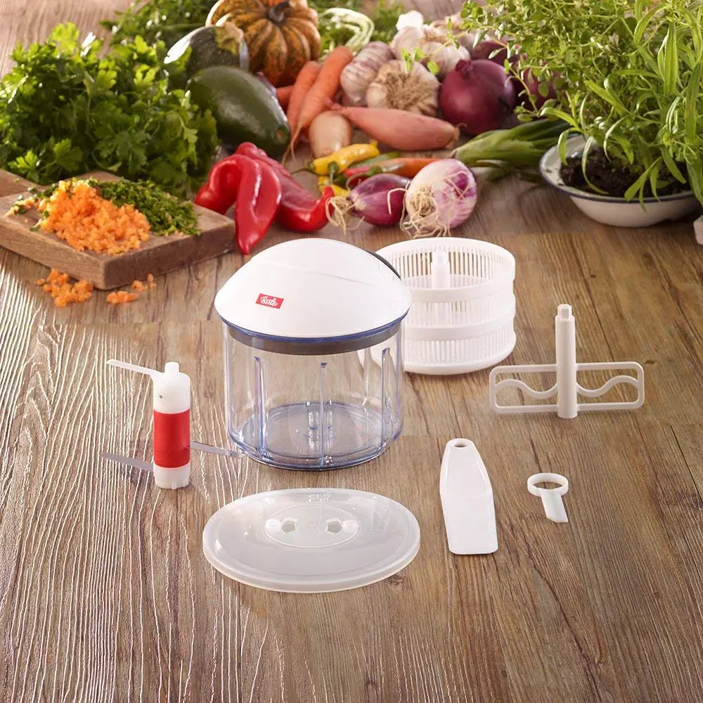 This is a Fissler finecut vegetable chopper with a pull mechanism, designed for slicing onions and other vegetables, and it comes with dishwasher-safe parts.