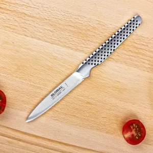 This is a Global paring knife with an 8cm stainless steel blade and a dimpled, ergonomic handle, handcrafted in Japan for excellent balance and precision.