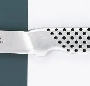 This is a Global paring knife with an 8cm stainless steel blade and a dimpled, ergonomic handle, handcrafted in Japan for excellent balance and precision.