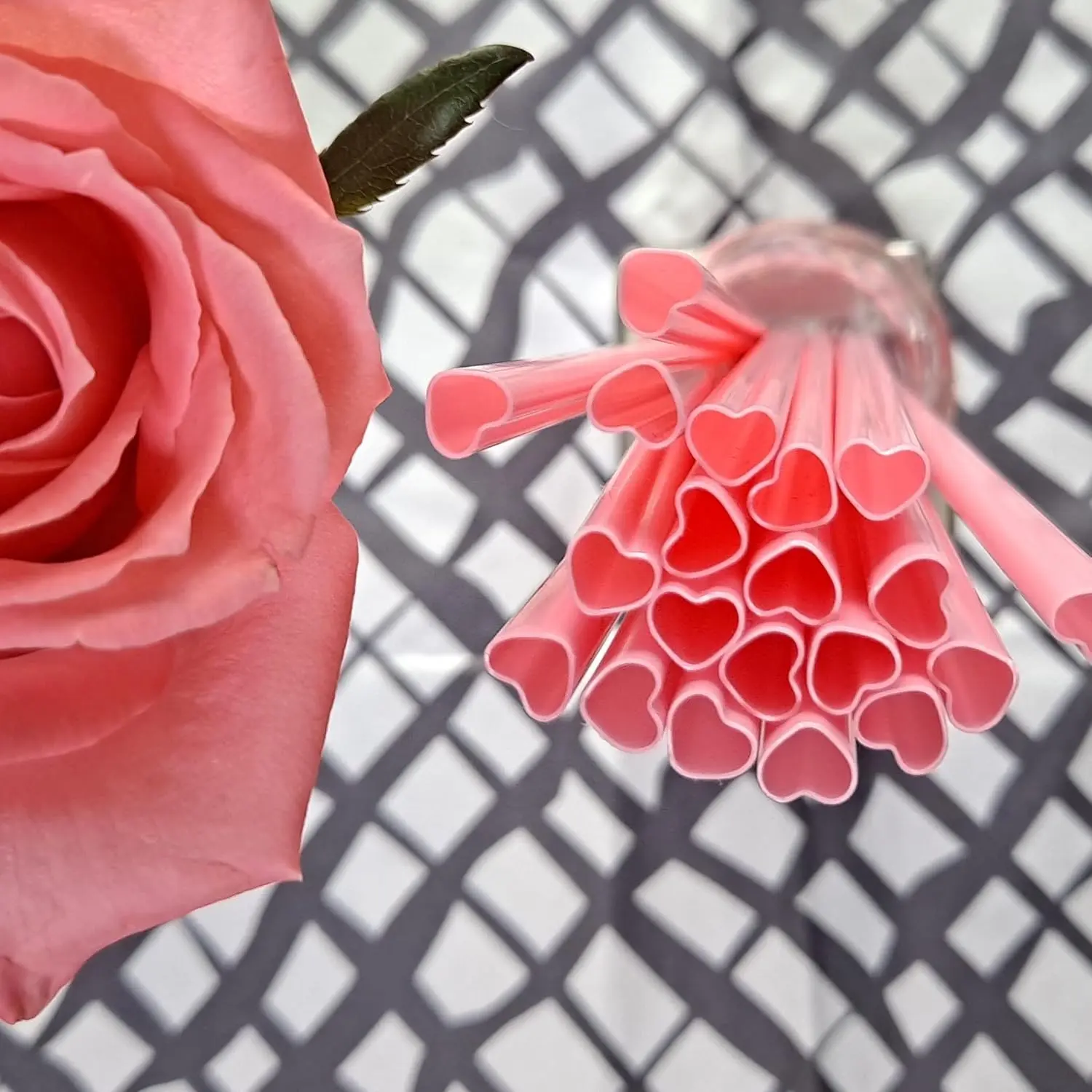 This set of 100 individually wrapped, disposable, heart-shaped pink plastic straws adds a touch of lovely, bright mood to daily drinks, parties, celebrations, picnics, and bridal showers.