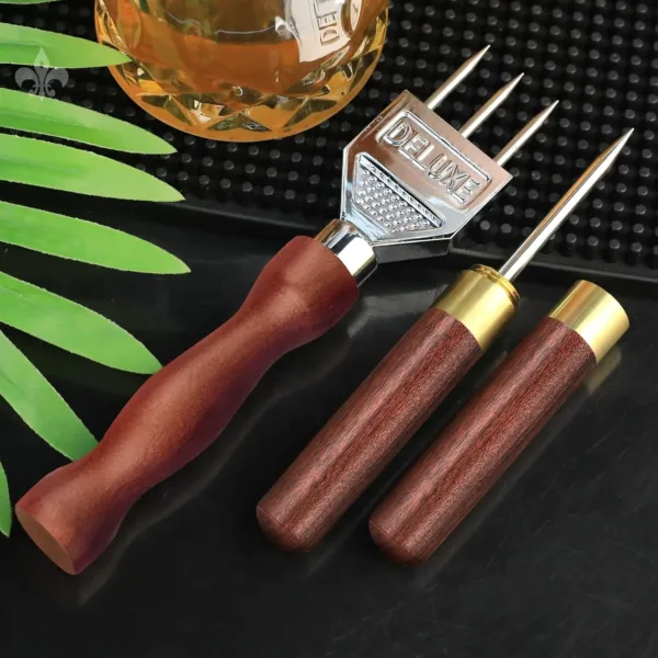 This three-pronged ice pick is made of stainless steel with a wooden handle and is a durable carving tool for bartenders to create ice chunks for chilling drinks.