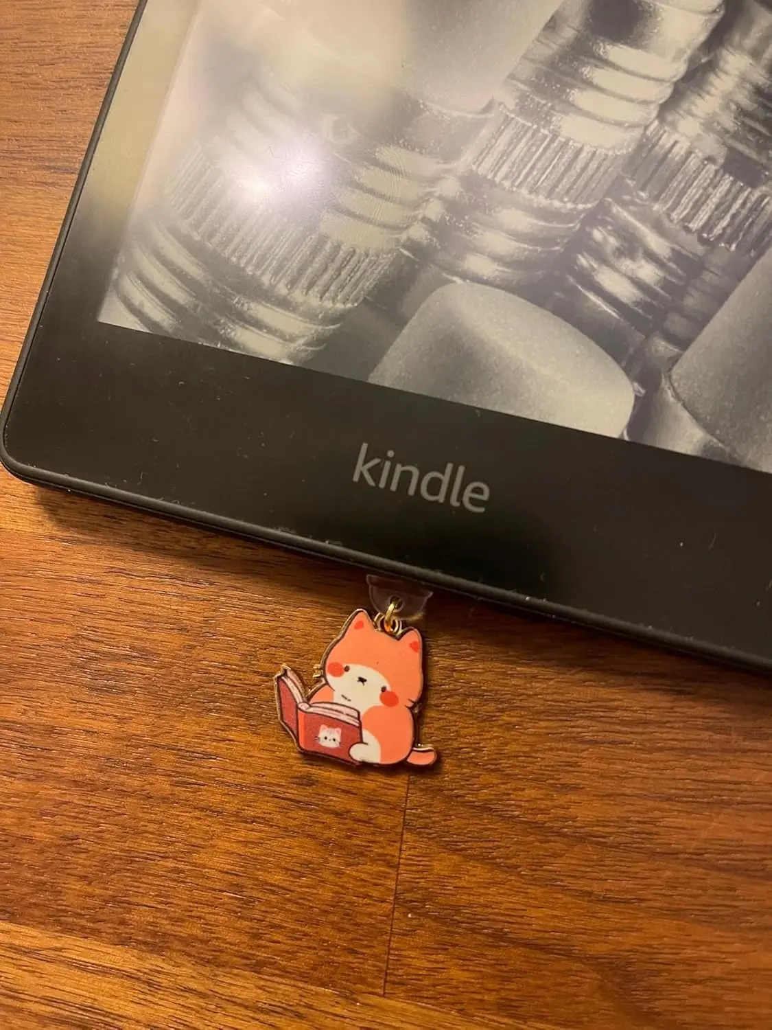 This 7-pack of bookish cat USB-C dust plugs protects your Kindle, iPhone 15, and other devices from dust and dirt while adding a charming touch.