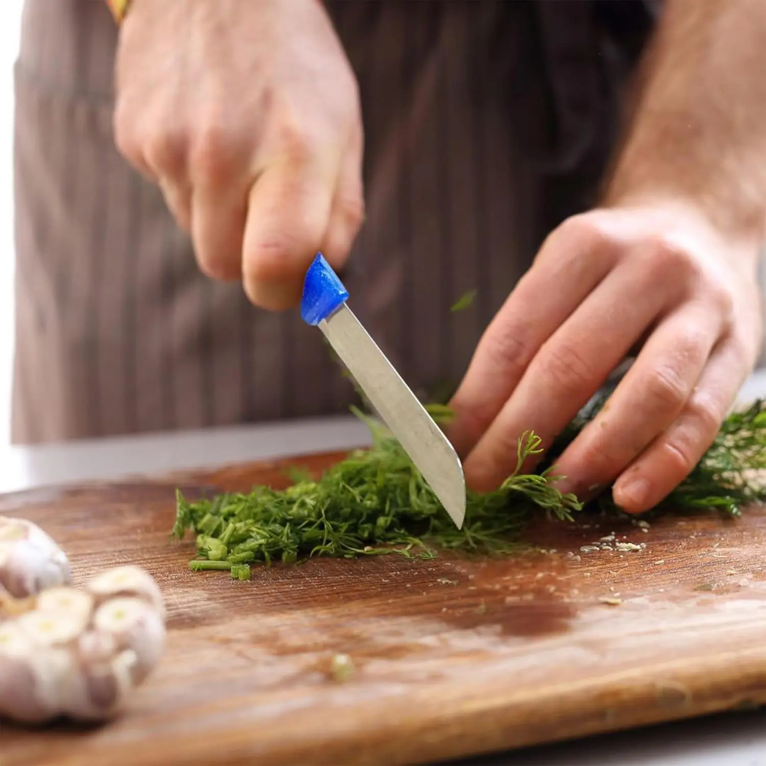 This ultra-sharp Solingen stainless steel kitchen knife features a serrated blade and ergonomic black handle for effortless slicing of vegetables and fruits.