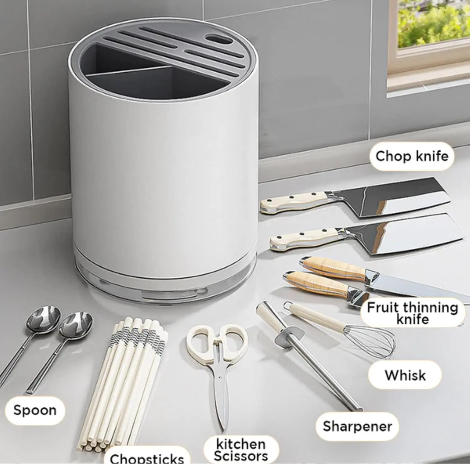 This white and gray universal knife block and cutlery organizer stores up to 14 knives, scissors, forks, and spoons while saving countertop space and keeping blades sharp with its rust-proof design and drain tray.