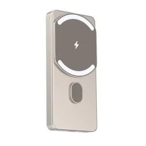 A slim, black magnetic power bank is wirelessly charging a smartphone, showcasing its compact design and convenient, hands-free charging capability.