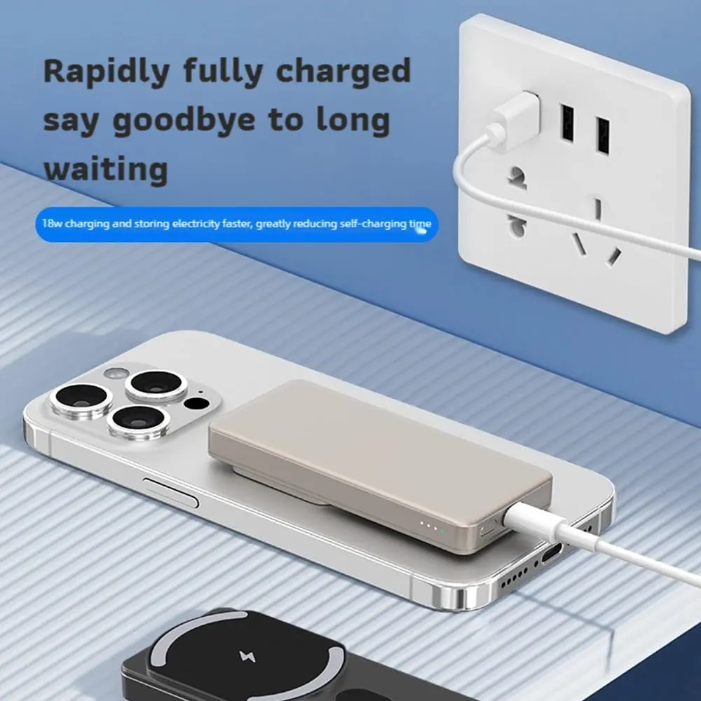 A slim, black magnetic power bank is wirelessly charging a smartphone, showcasing its compact design and convenient, hands-free charging capability.