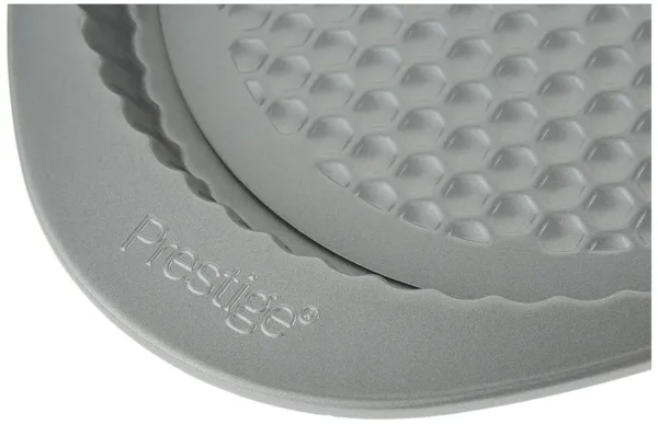 This 9 inch non stick flan tin with a honeycomb base ensures even baking and easy release, thanks to its premium non-stick coating, and it's freezer-to-oven safe for added convenience.