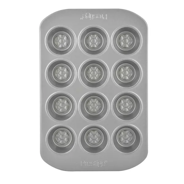 Bake delicious mini muffins with ease using the Prestige 12-cup muffin tin, featuring a nonstick surface, durable carbon steel construction, and a honeycomb base for even browning and easy release.