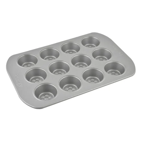 Bake delicious mini muffins with ease using the Prestige 12-cup muffin tin, featuring a nonstick surface, durable carbon steel construction, and a honeycomb base for even browning and easy release.