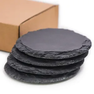 This set of four black slate coasters features a natural, rough-edged design, providing a rustic and stylish surface to protect furniture from drink spills and water rings in your kitchen, living room, or bar area.