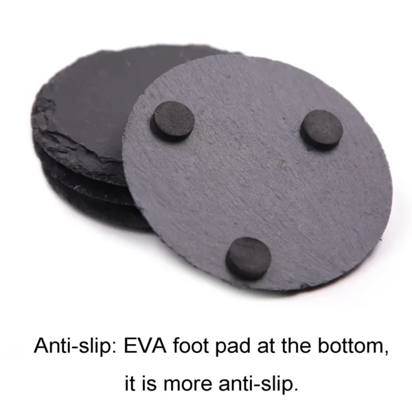 This set of four black slate coasters features a natural, rough-edged design, providing a rustic and stylish surface to protect furniture from drink spills and water rings in your kitchen, living room, or bar area.