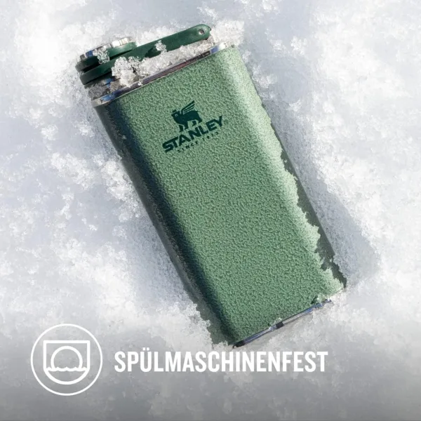 The green Stanley Classic Wide Mouth Hip Flask is made from stainless steel, features a wide mouth for easy pouring, and is leakproof for on-the-go use.