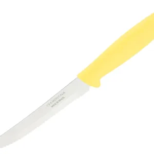 This vibrant yellow Tramontina Plenus knife features a sharp stainless steel blade perfect for slicing steaks and fruits, offering both elegance and functionality for everyday dining.