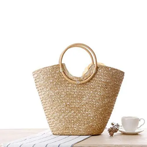 Off-white straw tote bag for women, perfect for summer, featuring a woven design and big flower accent, ideal as a beach bag or fashionable handbag.