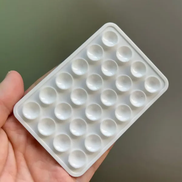 This four-pack of black silicone suction phone mounts provides a strong, hands-free grip on smooth surfaces like mirrors and shower tiles for taking TikTok videos and selfies with iPhones and Android phones.