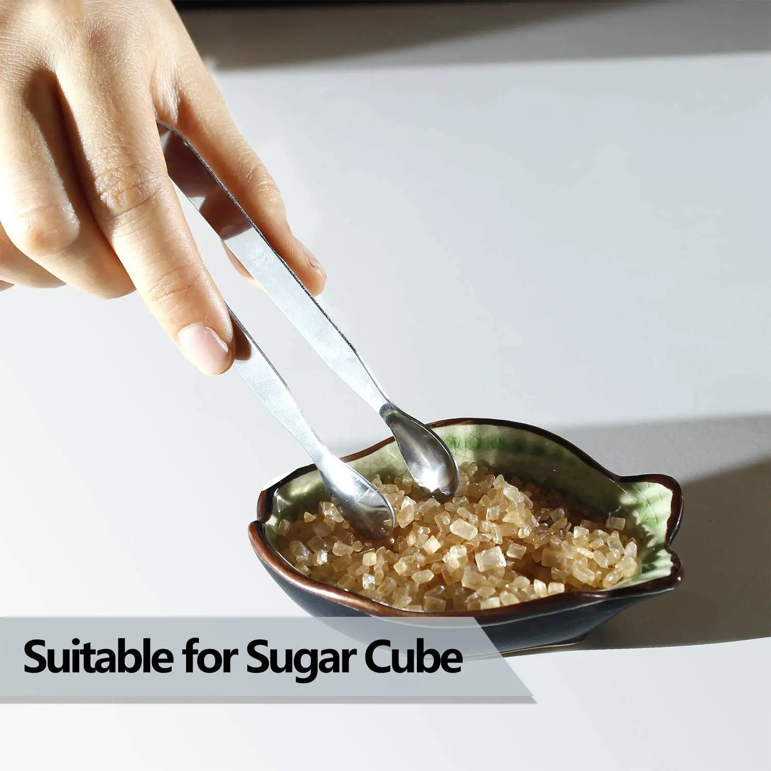 This six-piece set of stainless steel mini serving tongs is perfect for serving sugar cubes, appetizers, ice, and other small items at a party, buffet, or in the kitchen.