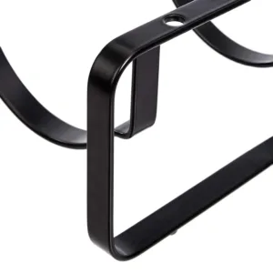 A stackable steel wine rack with a wave design securely holds wine bottles on a tabletop, preventing them from rolling.