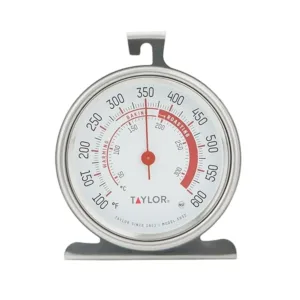 This Taylor stainless steel oven thermometer features a large, easy-to-read 3.25-inch dial with a red pointer, displaying temperatures from 100 to 600 degrees Fahrenheit, and is NSF certified for quality and durability, designed to either hang or stand inside your oven.