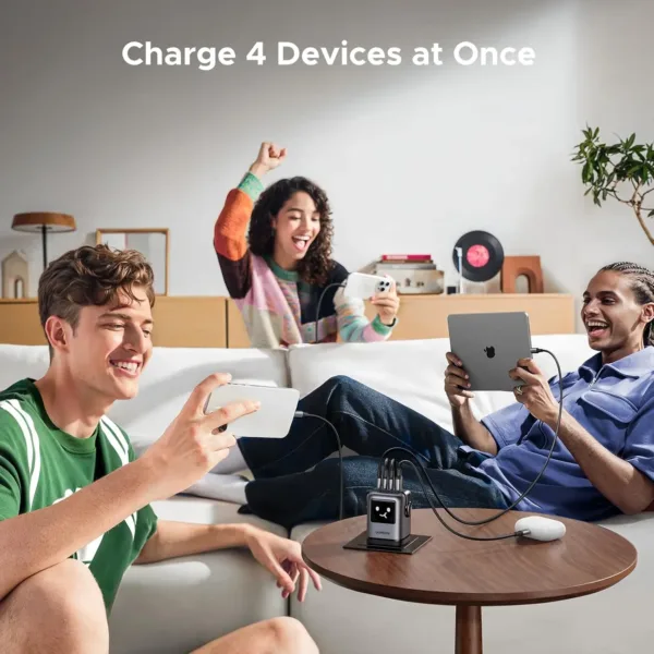 This is a UGREEN UNO 100W USB C charger with four ports, a GaN wall fast charger, and a funny LED display, designed as a compact power adapter for laptops, iPhones, and Galaxy devices.