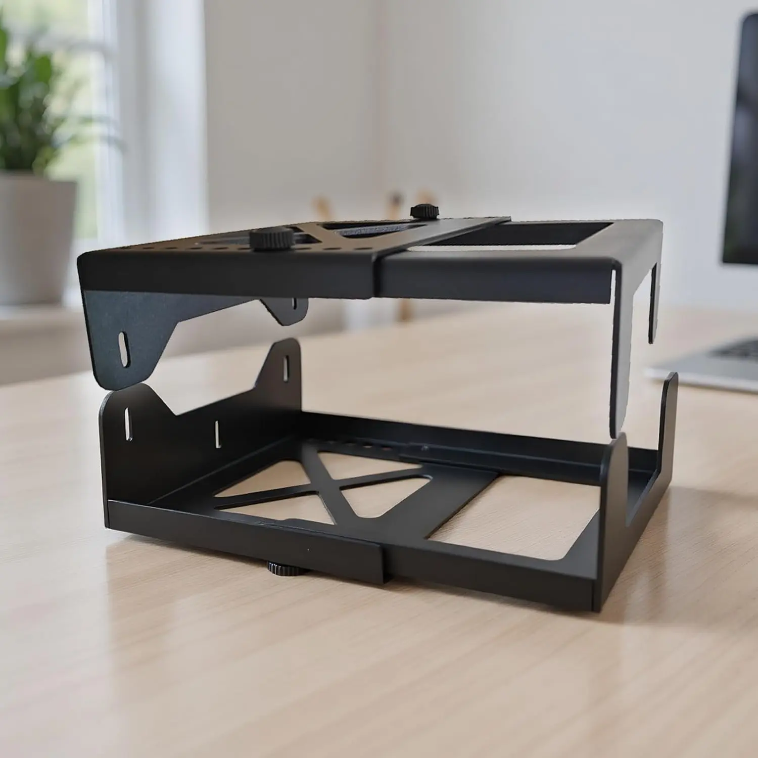 This adjustable under desk PC mount securely holds a computer tower vertically, maximizing desk space and providing stability with its steel frame and vibration-resistant mounting.