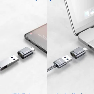 Two grey JSAUX USB-C to USB 3.0 OTG adapters plugged side-by-side into a MacBook Pro, demonstrating the offset design that allows simultaneous use with fast 5Gbps data transfer.