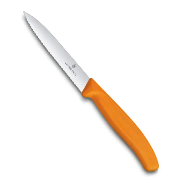 A close-up shows a Victorinox Swiss Classic 3.9-inch paring knife with a serrated blade and orange handle, perfect for precision cutting of fruits and vegetables in the kitchen.