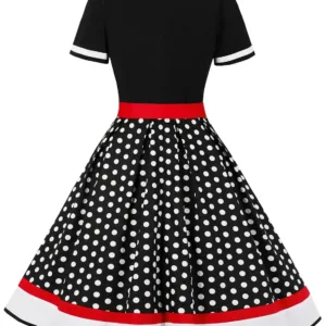 A woman poses in a Nihsatin vintage 1950s-style rockabilly swing dress, featuring a square neck, classic short sleeves, a fit and flare silhouette, and a removable belt, perfect for parties and special occasions.