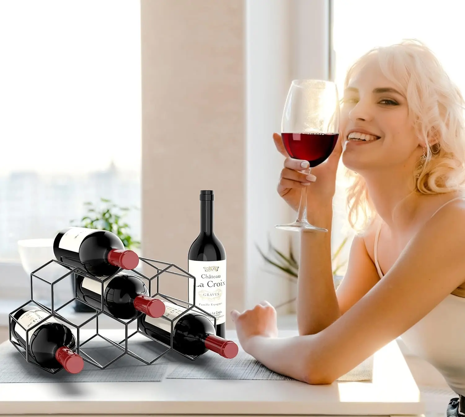 This modern countertop wine rack holds up to nine bottles and features a sleek black metal design; no assembly required.