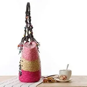 This is a handmade straw woven beach bag with embroidery and beading, perfect for women's fashion as a summer handbag or knitted tote.