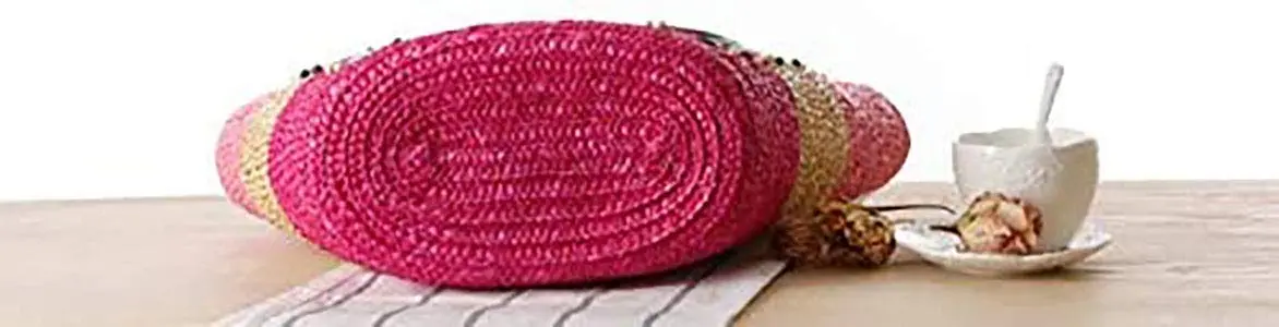 This is a handmade straw woven beach bag with embroidery and beading, perfect for women