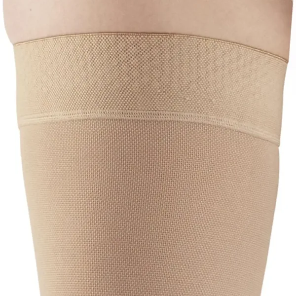 These Ames Walker black, open-toe thigh-high compression stockings provide 20-30 mmHg firm graduated support to relieve tired, aching legs and reduce mild varicosities, featuring a stay-up top band and made in the USA.